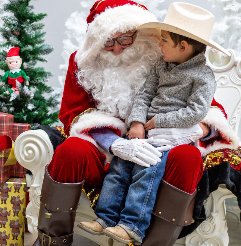 Holiday Events in Downtown Oroville 5 Santa sitting with a young boy at the Oroville Christmas Tree Lighting.